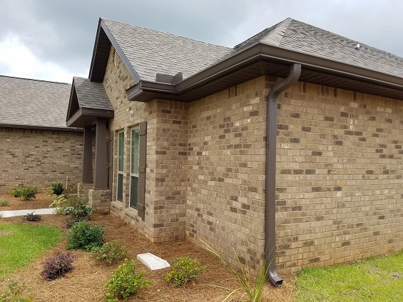 Bronze seamless gutter installed along a roofline