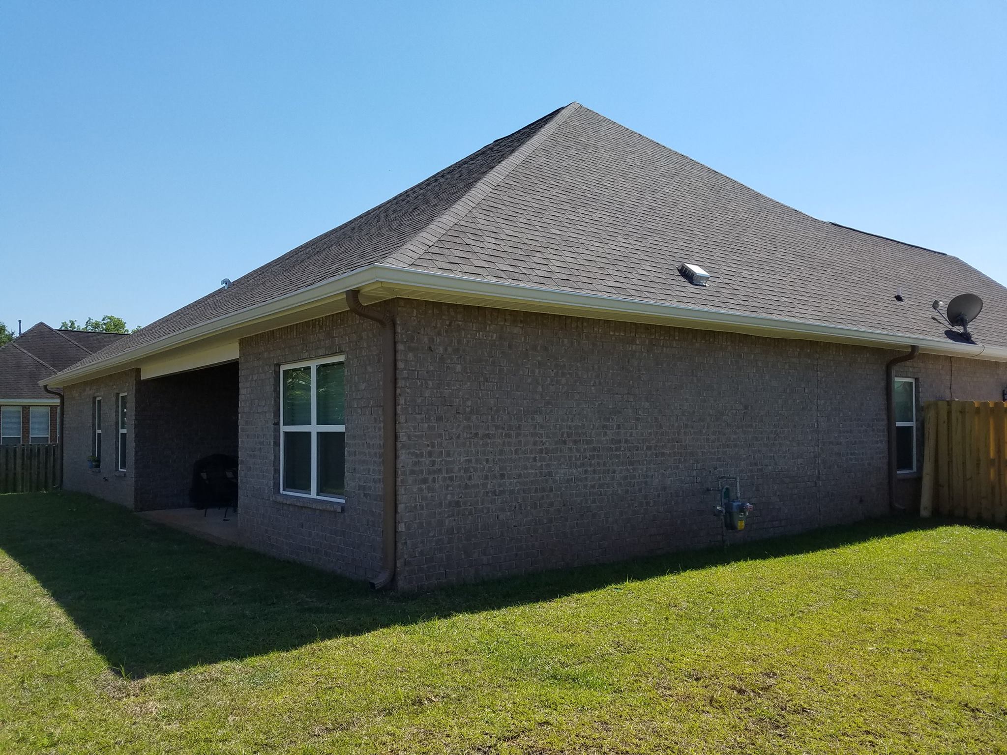 Residential gutter and downspout system for a Foley-area home