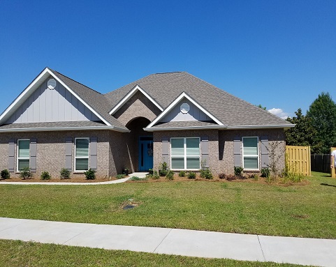White seamless gutters on a Fairhope-area home