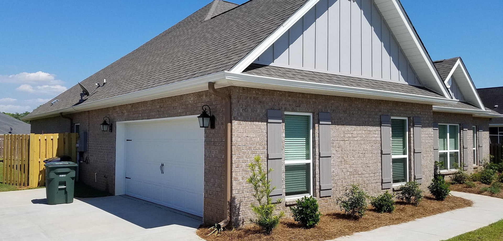 White seamless gutter installation by Gutter Tech
